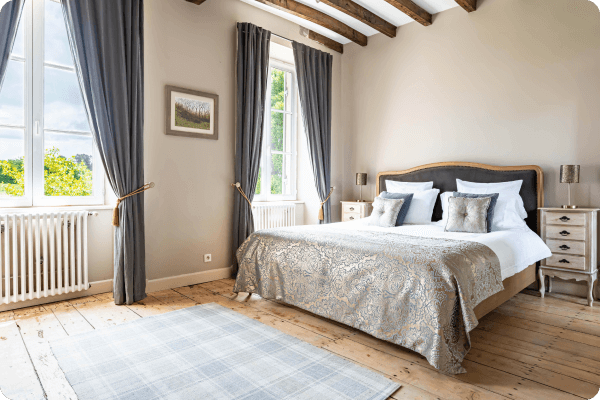 Large french style bedroom with large windows and light room