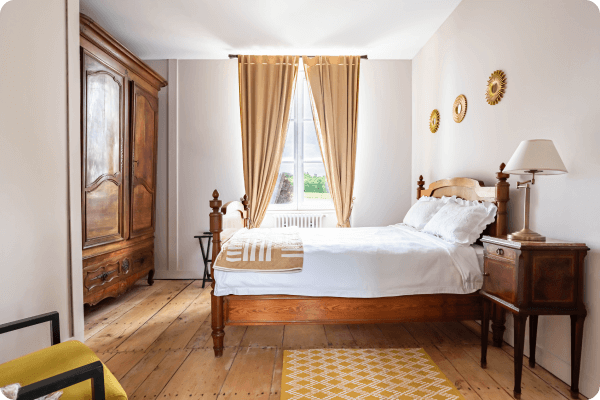 Oak finished bedroom with bright light from the big window