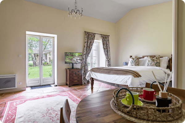 Large french style bedroom with large windows and light room