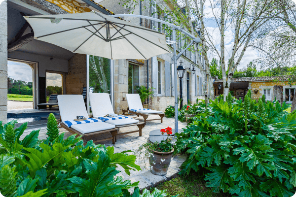 Sun lounges outside an indoor heated swimming pool