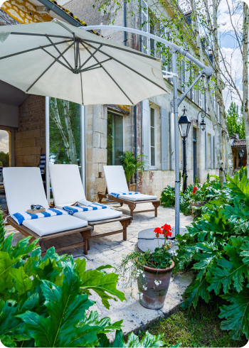 Sun lounges outside an indoor heated swimming pool