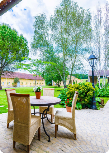 Outside kitchen overlooking a garden and trees